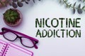 Text caption presenting Nicotine Addiction. Business overview condition of being addicted to smoking or tobacco