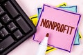 Text sign showing Nonprofit. Conceptual photo Activities that do not generate revenues to the executor written on Pink Sticky Note