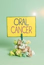 Text sign showing Oral Cancer. Conceptual photo the cancer of the lining of the lips mouth or upper throat Reminder pile