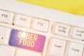 Text sign showing Order Food. Conceptual photo the process of requesting a preferred food in a restaurant White pc