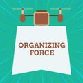 Text sign showing Organizing Force. Conceptual photo being United powerful group to do certain actions Drone holding