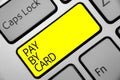 Text sign showing Pay By Card. Conceptual photo Payments on credit Debit Electronic Virtual Money Shopping Keyboard yellow key Int