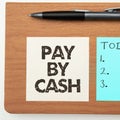 Text sign showing Pay By Cash. Conceptual photo Customer paying with money coins bills Retail shopping Royalty Free Stock Photo