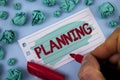 Text sign showing Planning. Conceptual photo Defining strategies for achieving a goal Process of making plans written by Man on Pa Royalty Free Stock Photo