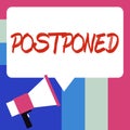 Text sign showing Postponed. Concept meaning to place later in order of precedence, preference, or importance