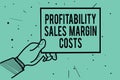 Text sign showing Profitability Sales Margin Costs. Conceptual photo Business incomes revenues Budget earnings Man hand holding pa Royalty Free Stock Photo