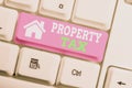 Text sign showing Property Tax. Conceptual photo an ad valorem tax on the value of a property Millage rate White pc