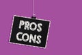 Text sign showing Pros Cons. Conceptual photo The favorable and unfavorable factors or reasons of person Hanging blackboard messag