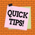 Text sign showing Quick Tips. Conceptual photo small but particularly useful piece of practical advice Paper stuck