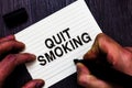 Text sign showing Quit Smoking. Conceptual photo Discontinuing or stopping the use of tobacco addiction Man holding marker noteboo Royalty Free Stock Photo