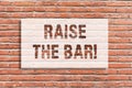 Text sign showing Raise The Bar. Conceptual photo Set higher standards challenges seeking for excellence Brick Wall art