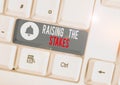 Text sign showing Raising The Stakes. Conceptual photo Increase the Bid or Value Outdo current bet or risk White pc