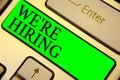 Text sign showing We re are Hiring. Conceptual photo Advertising Employment Workforce Placement New Job Keyboard green key Intenti Royalty Free Stock Photo