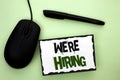 Text sign showing We're Hiring. Conceptual photo Recruiting Hiring Now Recruitment Vacancy Announced Hire written on Sticky Note