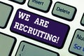 Text sign showing We Are Recruiting. Conceptual photo get someone to join something like community or job Keyboard key Royalty Free Stock Photo