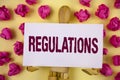 Text sign showing Regulations. Conceptual photo Rules Laws Corporate Standards Policies Security Statements written on Sticky Note Royalty Free Stock Photo