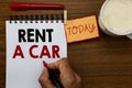 Text sign showing Rent A Car. Conceptual photo paying for temporary vehicle usage from one day to months Man holding marker notebo Royalty Free Stock Photo