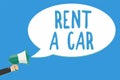 Text sign showing Rent A Car. Conceptual photo paying for temporary vehicle usage from one day to months Man holding megaphone lou Royalty Free Stock Photo