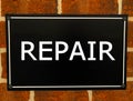 Text sign showing repair.