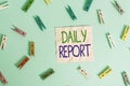 Text sign showing Daily Report. Conceptual photo document containing information of of activities done ina day Colored clothespin