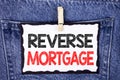 Text sign showing Reverse Mortgage. Conceptual photo Elderly homeowner retirement option regular payment benefit written on White