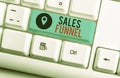 Text sign showing Sales Funnel. Conceptual photo process through which a company ells its products to buyers White pc