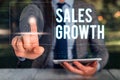 Text sign showing Sales Growth. Conceptual photo ability to increase revenue over a fixed period of time Woman wear Royalty Free Stock Photo