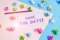 Text sign showing Save The Date. Conceptual photo reserve the mentioned future wedding date on their calendar Colored crumpled Royalty Free Stock Photo