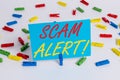 Text sign showing Scam Alert. Conceptual photo fraudulently obtain money from victim by persuading him Colored