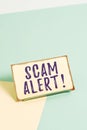 Text sign showing Scam Alert. Conceptual photo fraudulently obtain money from victim by persuading him Paper placed Royalty Free Stock Photo