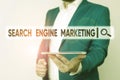 Text sign showing Search Engine Marketing. Conceptual photo promote Website visibility on searched result pages Man in