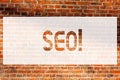 Text sign showing Seo. Conceptual photo Search Engine Optimization Marketing Keywording Brick Wall art like Graffiti motivational