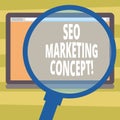 Text sign showing Seo Marketing Concept. Conceptual photo Strategy that implement to satisfy customers need Magnifying