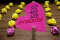 Text sign showing Seo And Web Optimization. Conceptual photo Search Engine Keywording Marketing Strategies Paperclip hold pink hea