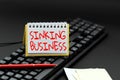 Text sign showing Sinking Business. Conceptual photo the company or other organization that is failing Copying Old Ideas