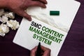 Text sign showing Smc Content Management System. Conceptual photo mangae creation and modification of posts Man holding