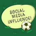 Text sign showing Social Media Influence. Conceptual photo Individuals ability to affect others thinking Soccer Ball on the Grass