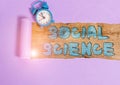 Text sign showing Social Science. Conceptual photo scientific study of huanalysis society and social relationships Alarm clock and