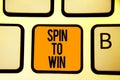 Text sign showing Spin To Win. Conceptual photo Try your luck Fortune Casino Gambling Lottery Games Risk Keyboard orange key Inten