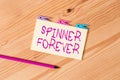 Text sign showing Spinner Forever. Conceptual photo stress reliever for showing who tend to fidget Flat top Colored clothespin