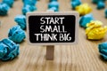Text sign showing Start Small Think Big. Conceptual photo Initiate with few things have something great in mind Paperclip hold wri