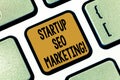 Text sign showing Startup Seo Marketing. Conceptual photo Attract qualified leads while your work improving Keyboard key