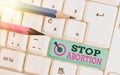 Text sign showing Stop Abortion. Conceptual photo advocating against the practice of abortion Prolife movement White pc