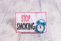 Text sign showing Stop Smoking. Conceptual photo Discontinuing or stopping the use of tobacco addiction. Royalty Free Stock Photo