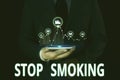 Text sign showing Stop Smoking. Conceptual photo Discontinuing or stopping the use of tobacco addiction Male human wear Royalty Free Stock Photo