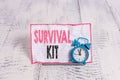 Text sign showing Survival Kit. Conceptual photo Emergency Equipment Collection of items to help someone.