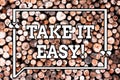 Text sign showing Take It Easy. Conceptual photo Be relaxed do not worry about things stay calmed and rest Wooden