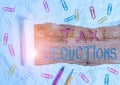 Text sign showing Tax Deductions. Conceptual photo amount or cost that can be subtracted from someone s is income Stationary and Royalty Free Stock Photo