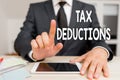 Text sign showing Tax Deductions. Conceptual photo an amount or cost that subtracted from someone s is income. Royalty Free Stock Photo