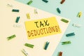 Text sign showing Tax Deductions. Conceptual photo reduction income that is able to be taxed of expenses Colored